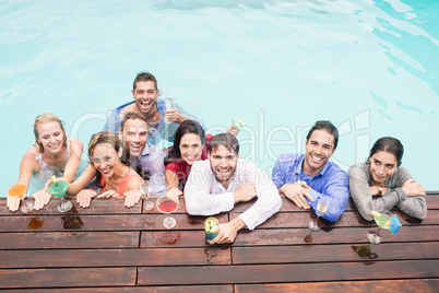 Happy young friends having drinks