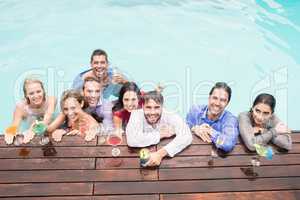 Happy young friends having drinks