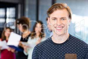 Portrait of man smiling in office