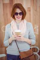 Red haired hipster drinking coffee