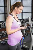 Pregnant woman looking at a stopwatch
