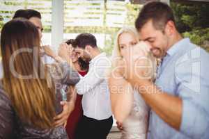 Group of young friends dancing