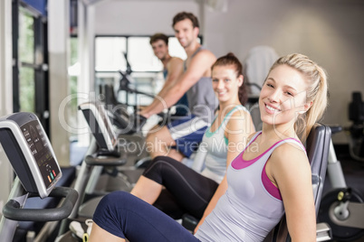 Fit people doing exercise bike