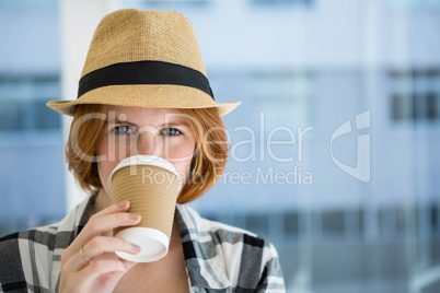 Fashion hipster having a coffee