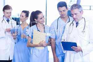 Doctors examining medical report