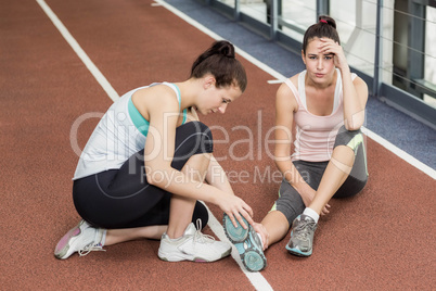 Fit woman having an ankle pain