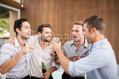 Group of young men having drinks