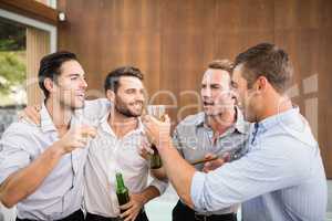 Group of young men having drinks