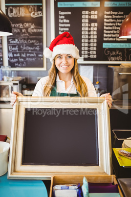 Cute waitress holding a blackboard