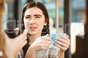 Friends chatting over coffee