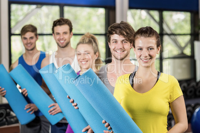 Group of people with fitness mat