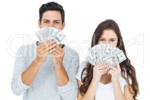 Happy couple holding money