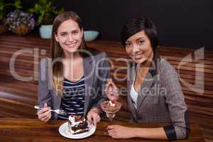 Pretty women eating desserts