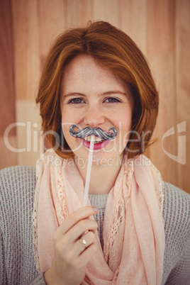 Hipster wearing a fake mustache