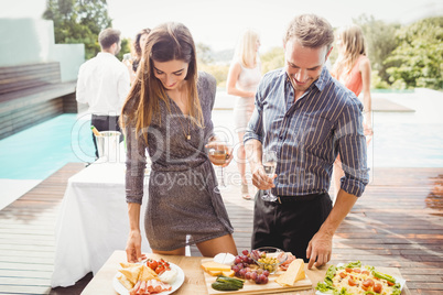 Happy young friends having drinks