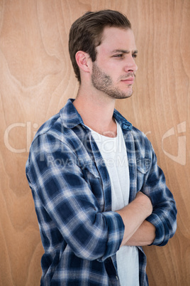 Handsome hipster with arms crossed