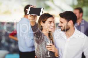 Young friends taking selfie