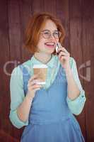 Hipster talking on phone having coffee