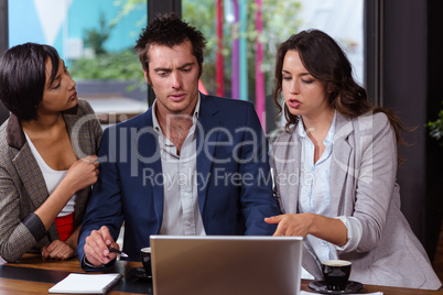 People using laptop together