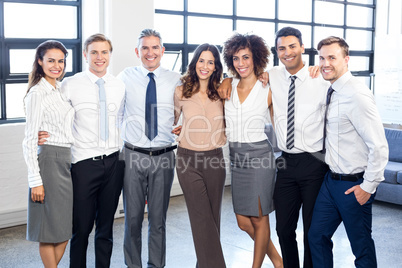 Businesspeople standing together in office