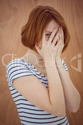 beautiful hipster woman hiding her face