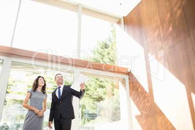 Real-estate agent showing young woman new home