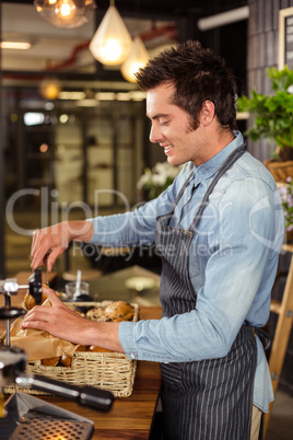 Waiter serving viennese pastries to a customer