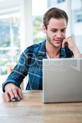 Handsome man working on laptop