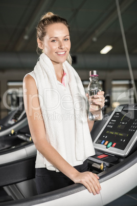 Smiling woman drinking water Smiling woman drinking water