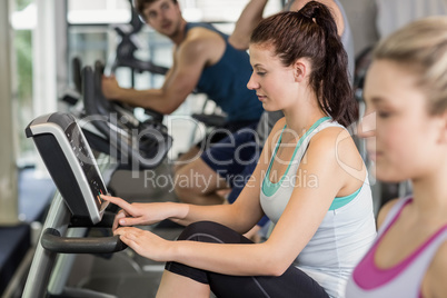 Fit people doing exercise bike