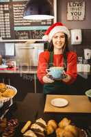 Cute waitress giving a coffee to customer