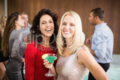Portrait of beautiful women having drinks