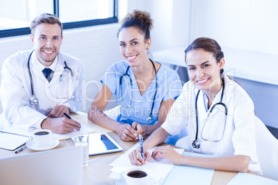 Medical team smiling at conference room