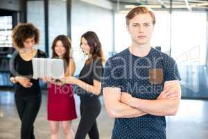 Man looking at camera with arms crossed