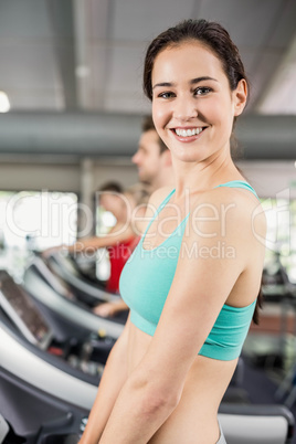 Fit woman running on treadmill