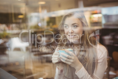 Woman drinking a cup of coffee