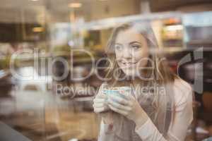 Woman drinking a cup of coffee