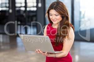 Beautiful businesswoman young woman using laptop