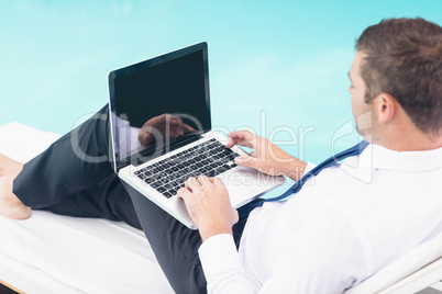 Smarty dressed man using laptop