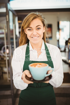 Waitress serving a cup of coffee