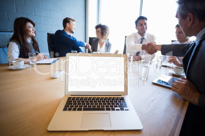Businesspeople having a discussion in conference room Businesspeople having a discussion in conference room