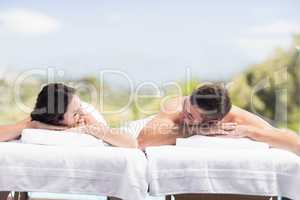 Young couple relaxing on massage table