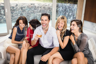 Happy man sitting with woman and having fun