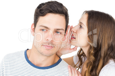 Young couple sharing a secret