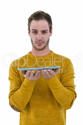 Hipster man holding a tablet