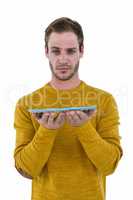 Hipster man holding a tablet