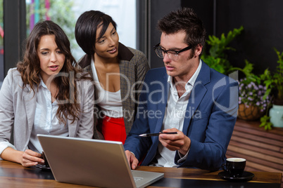 People using laptop together