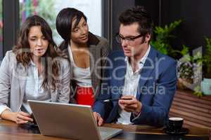 People using laptop together