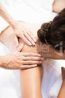 Woman receiving a back massage from masseur