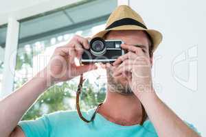Hipster man taking picture